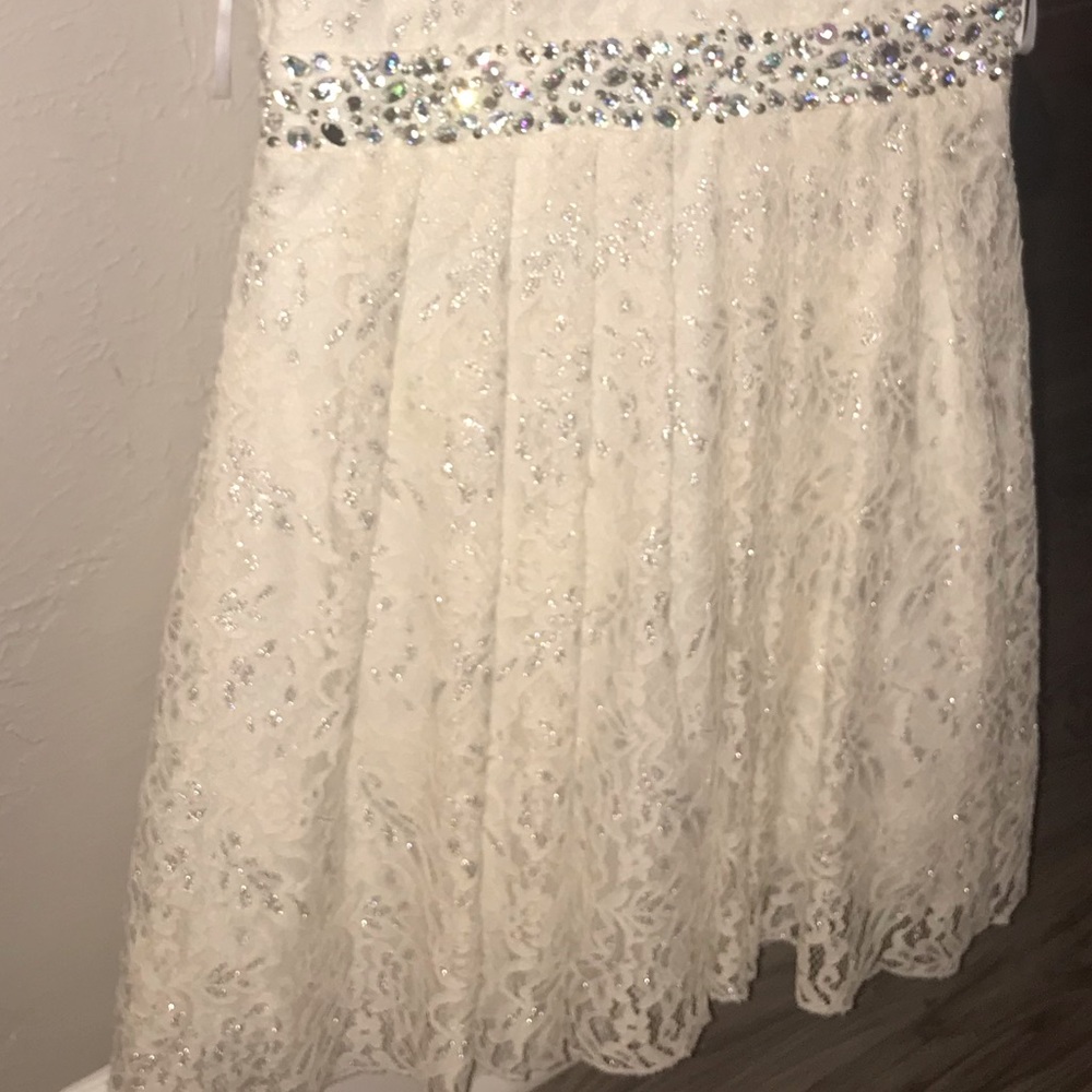 white lace dress with a diamond belt
